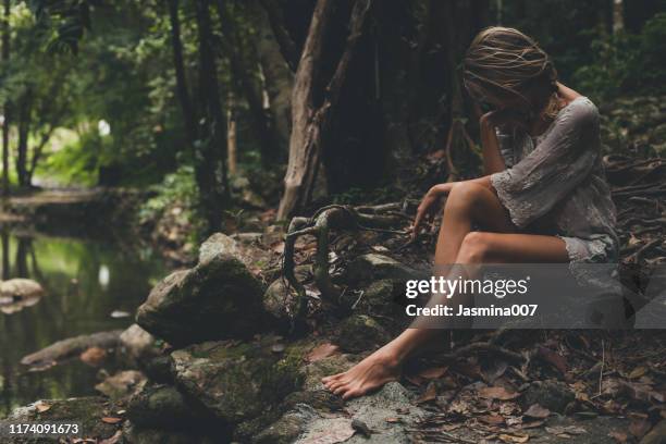 beautiful young woman enjoys in nature - jungle stories stock pictures, royalty-free photos & images
