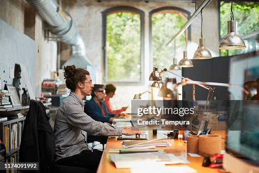 Designer Using Computer Professional Designer Working And Using A Computer Small Business High ...