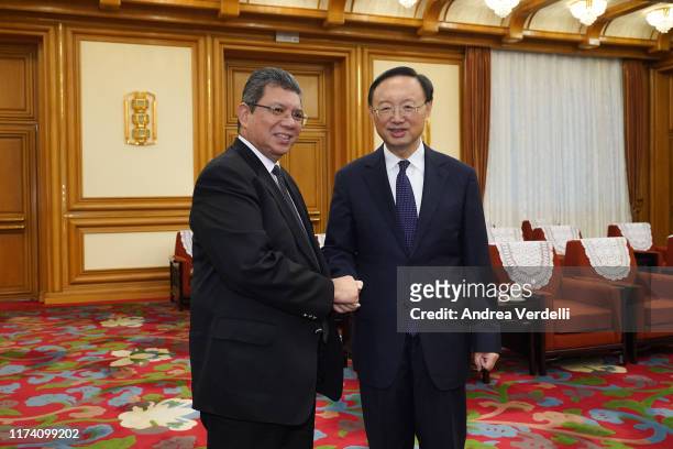 Member of the Politburo of the Communist party of China Yang Jiechi shakes hands with Malaysian Foreign Minister Dato’ Saifuddin Abdullah during the...