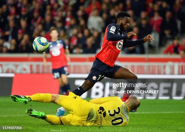 Nimes' Ahoueke Steeve Kévin Denkey celebrates with team mate after... News Photo - Getty Images