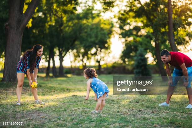 happiness is family - playing catch stock pictures, royalty-free photos & images