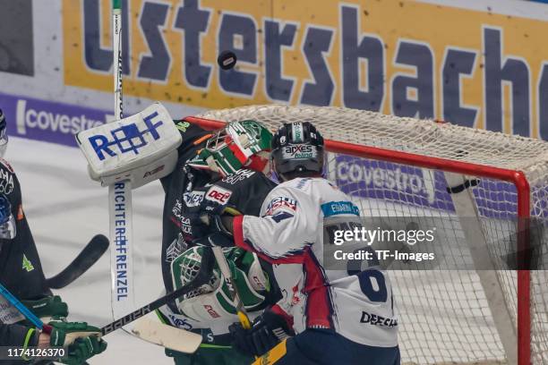 Goalkeeper Olivier Roy of Augsburger Panther and Sean Backman of Eisbaeren Berlin battle for the ball during the DEL match between Augsburger Panther...