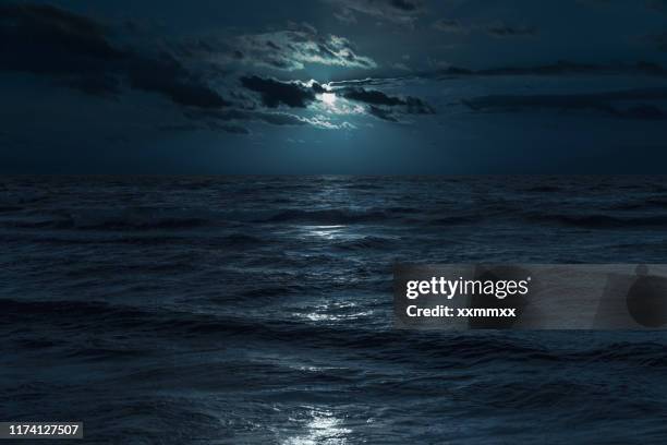 baltic sea at moonlight - moonlight stock pictures, royalty-free photos & images