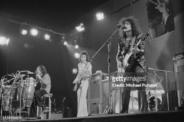 English glam rock group T Rex perform live on stage at the Empire Pool, Wembley in London on 20th March 1972. The band are, from left to right:...