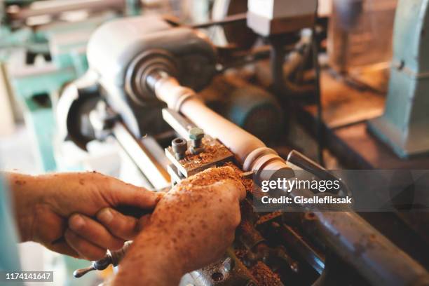 detail of a senior man working in a carpentry, using a lathe - lathe stock pictures, royalty-free photos & images
