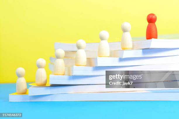 stacked books - learn to lead stock pictures, royalty-free photos & images