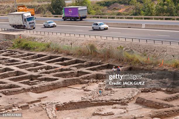 Israeli archaeologists work at the archaeological site of En Esur where a 5000-year-old city was uncovered, near the Israeli town of Harish on...