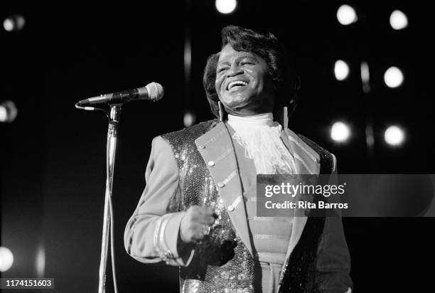 American R&B, Funk, and Soul singer James Brown smiles as he performs onstage at the Paramount, New York, New York, February 28, 1992.