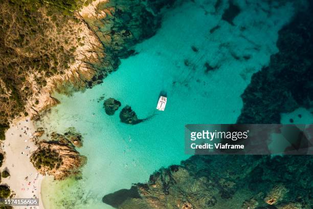 drone shots of a catamaran - catamaran sailing stock-fotos und bilder