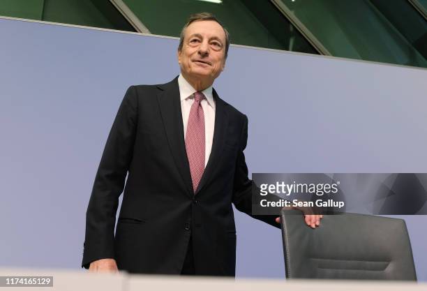Mario Draghi, President of the European Central Bank, arrives to speak to the media following a meeting of the ECB governing board on September 12,...