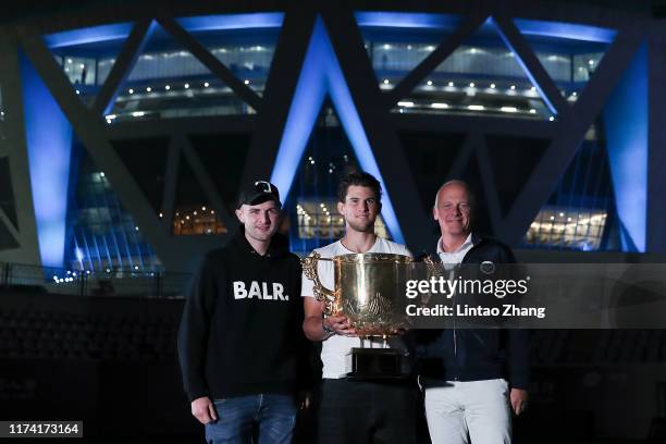 Dominic Thiem of Austria poses with the trophy celebrate with team after win the Men's Singles final match against Stefanos Tsitsipas of Greece on...