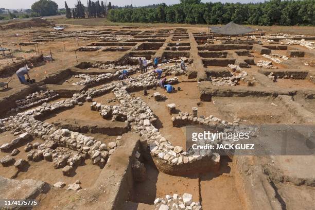 Israeli archaeologists work at the ancient site of En Esur where a 5000-year-old city was uncovered, near the Israeli town of Harish on October 06,...