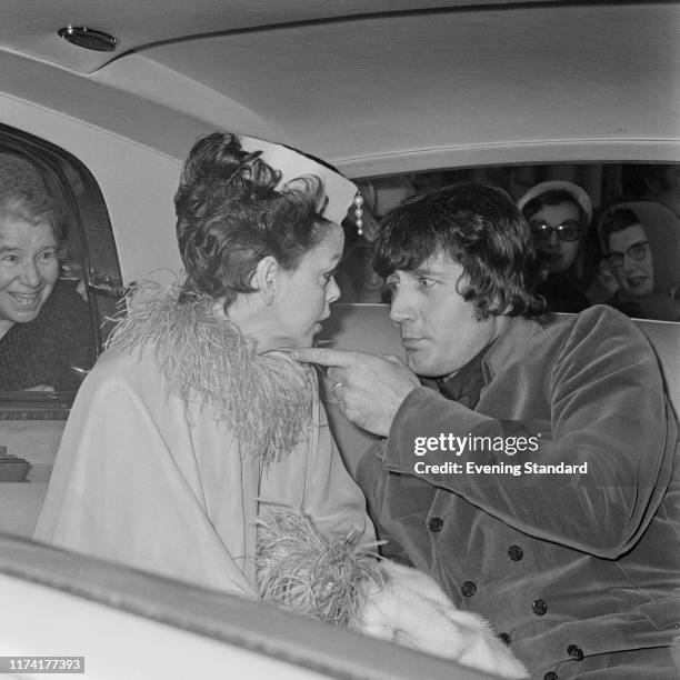 American actress and singer Judy Garland seated with her new 5th husband Mickey Deans in their limousine car as they leave Chelsea Register Office in...