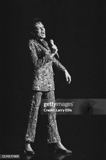 American actress and singer Judy Garland performs live on stage at The Talk of the Town nightclub on Charing Cross Road in London on 31st December...