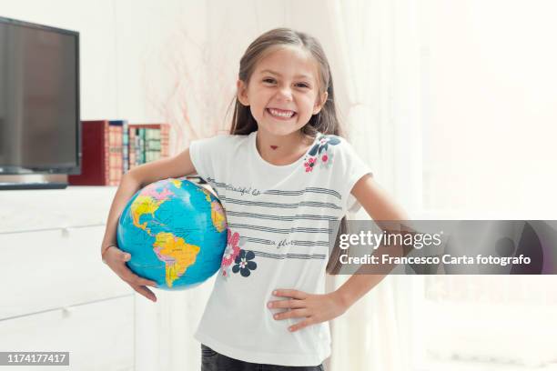 little girl with globe - bordsjordglob bildbanksfoton och bilder