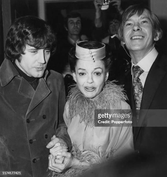 American actress and singer Judy Garland posed with her new 5th husband Mickey Deans and best man Johnnie Ray on the day of their wedding at Chelsea...