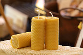 Candles with pattern in the shape of beeswax alveoli