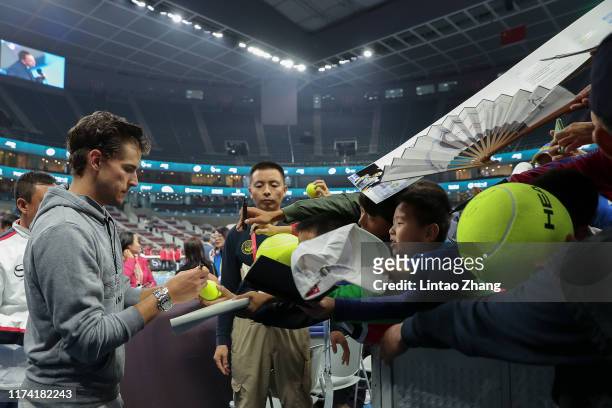 Dominic Thiem of Austria sign to fans after win the Men's Singles final match against Stefanos Tsitsipas of Greece on Day nine of 2019 China Open at...