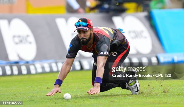 In this handout image provided by CPL T20, Ali Khan of Trinbago Knight Riders fielding during the Hero Caribbean Premier League Play-Off match 31...