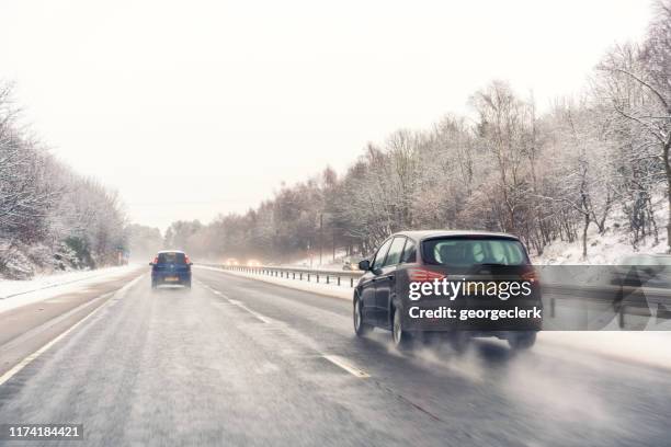 british winter driving - snow melting on car stock pictures, royalty-free photos & images