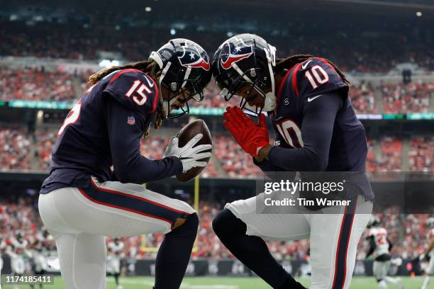Will Fuller and DeAndre Hopkins of the Houston Texans celebration a touchdown reception against the Atlanta Falcons in the first quarter at NRG...