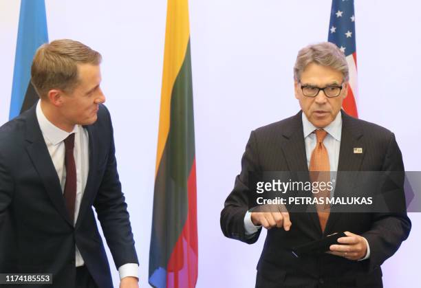 Lithuanian Minister of Energy Zygimantas Vaiciunas listens to US Secretary of Energy Rick Perry after signing an agreement on strengthening energy...