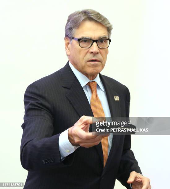 Secretary of Energy Rick Perry gives a pencil back after signing an agreement with Estonian, Lithuanian and Latvian counterparts on strengthening...