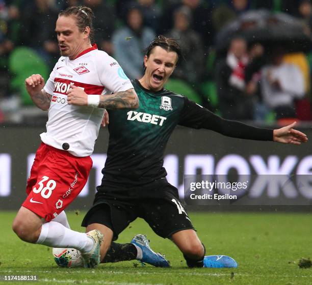 Kristoffer Olsson of FC Krasnodar vies for the ball with Andrey Yeshchenko of FC Spartak Moscow during the Russian Premier League match between FC...