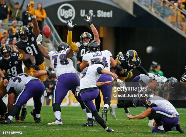 Justin Tucker of the Baltimore Ravens kicks the game winning field goal in overtime against the Pittsburgh Steelers on October 6, 2019 at Heinz Field...