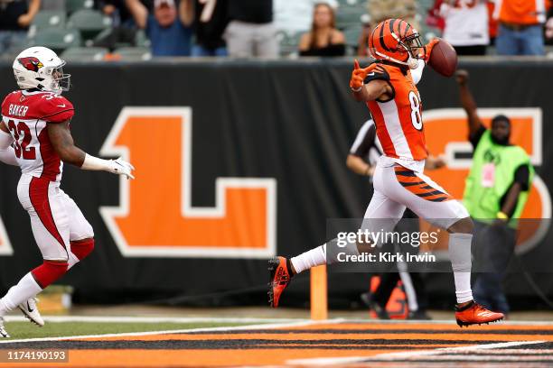 Tyler Boyd of the Cincinnati Bengals celebrates after running past Budda Baker of the Arizona Cardinals to score a touchdown during the fourth...