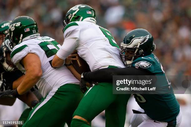Vinny Curry of the Philadelphia Eagles sacks Luke Falk of the New York Jets in the third quarter at Lincoln Financial Field on October 6, 2019 in...