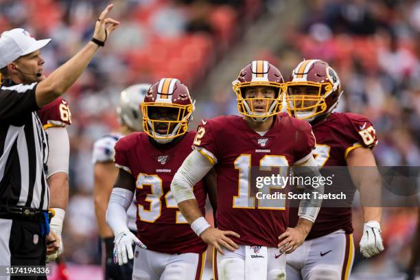 Colt McCoy of the Washington Redskins looks on after an offensive penalty against the New England Patriots during the second half at FedExField on...