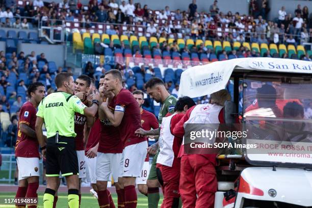 Fabio Pisacane from Cagliari is being taken away on a stretcher during the Serie A match between AS Roma and Cagliari at Olimpico Stadium. .