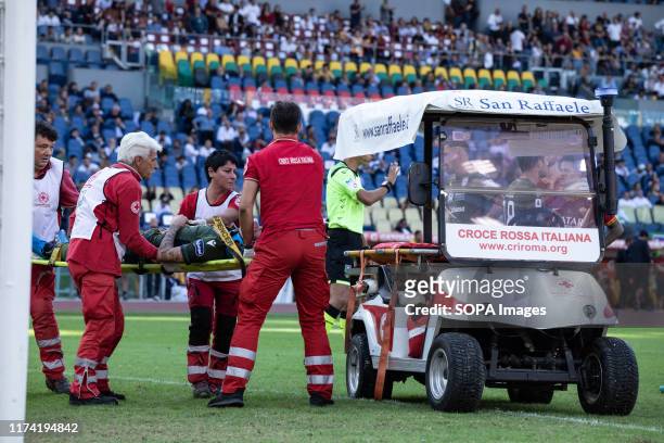 Fabio Pisacane from Cagliari is being taken away on a stretcher during the Serie A match between AS Roma and Cagliari at Olimpico Stadium. .