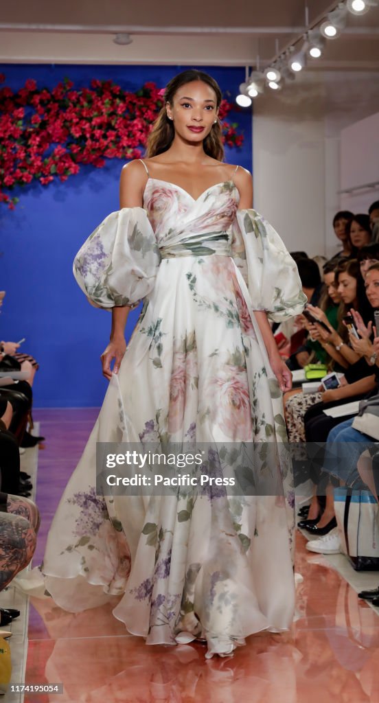 A model walks the runway at the Theia Fall 2020 collection...