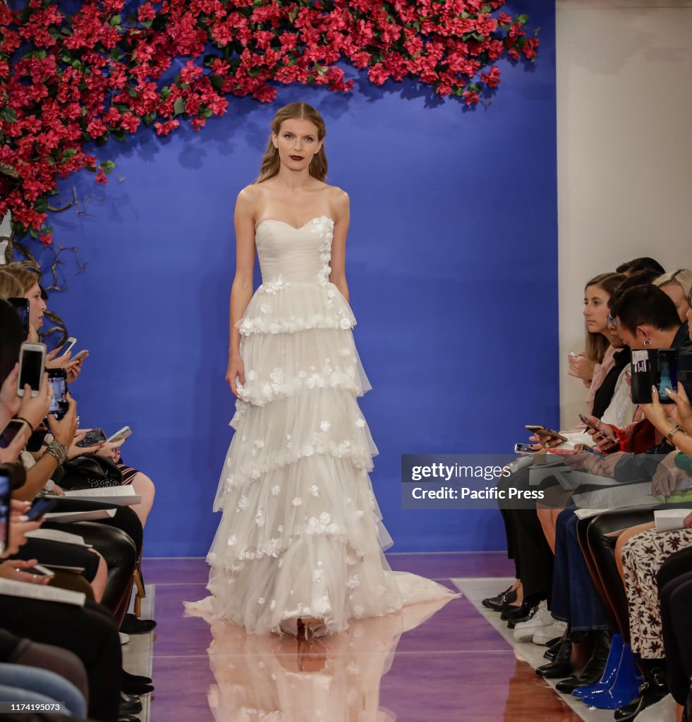 A model walks the runway at the Theia Fall 2020 collection...