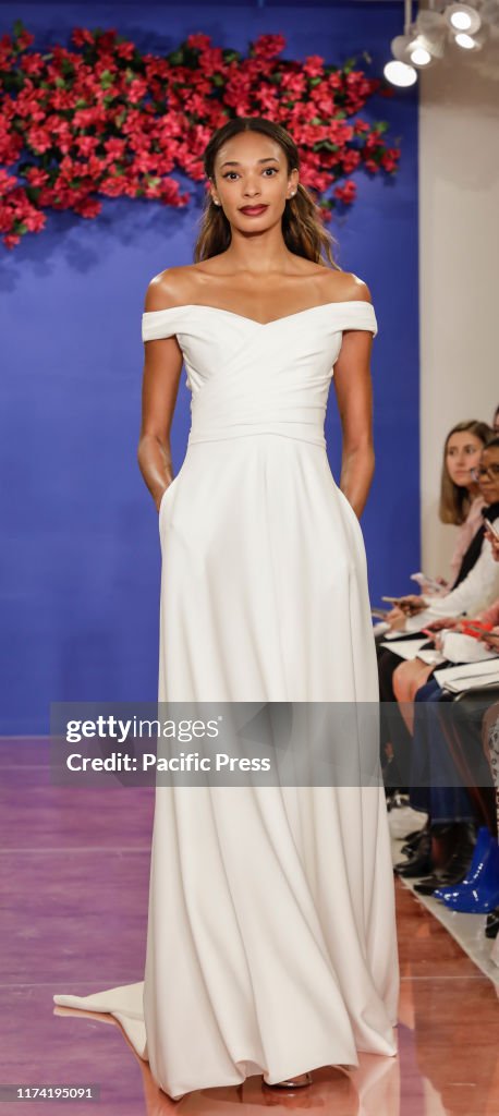 A model walks the runway at the Theia Fall 2020 collection...