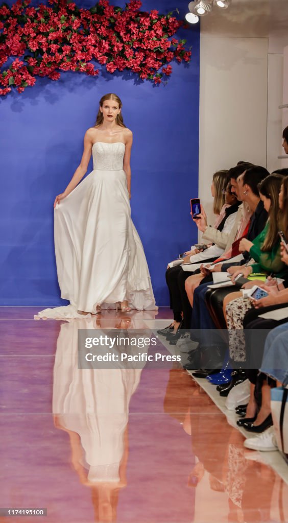 A model walks the runway at the Theia Fall 2020 collection...