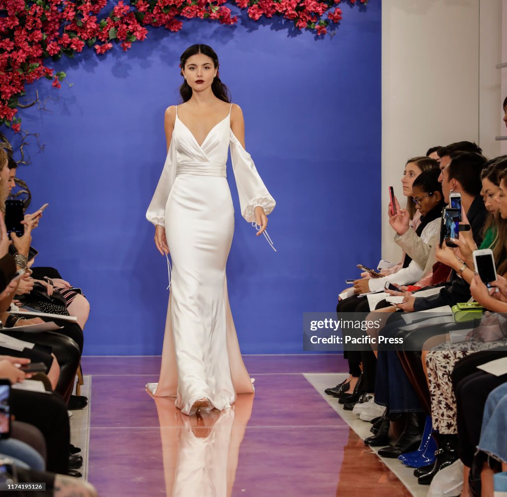 A model walks the runway at the Theia Fall 2020 collection...