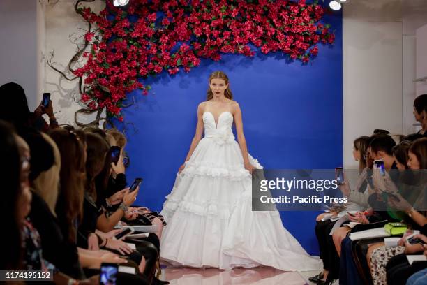 Model walks the runway at the Theia Fall 2020 collection during New York Bridal Week at the Theia Showroom, Manhattan.