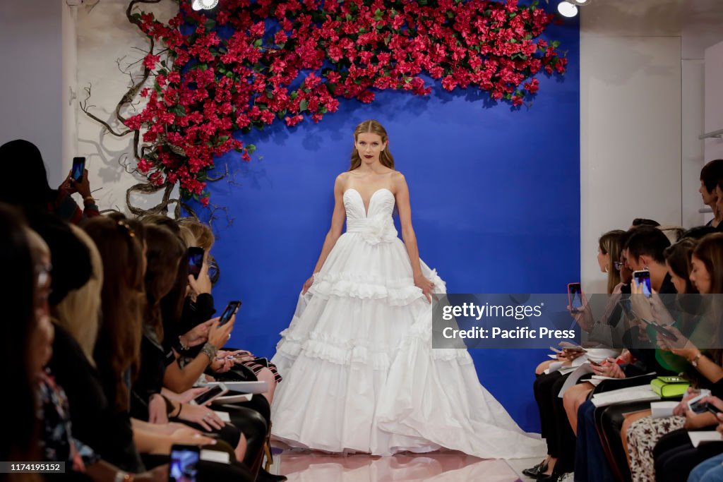A model walks the runway at the Theia Fall 2020 collection...