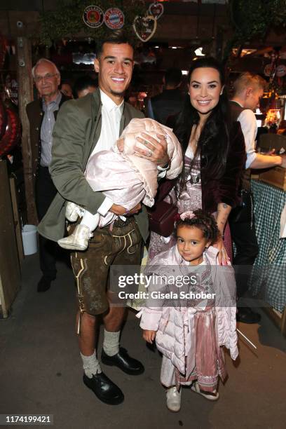 Philippe Coutinho, soccer player of FC Bayern Muenchen and his wife Aine Coutinho and daughter and his baby during the annual "FC Bayern Wiesn" at...