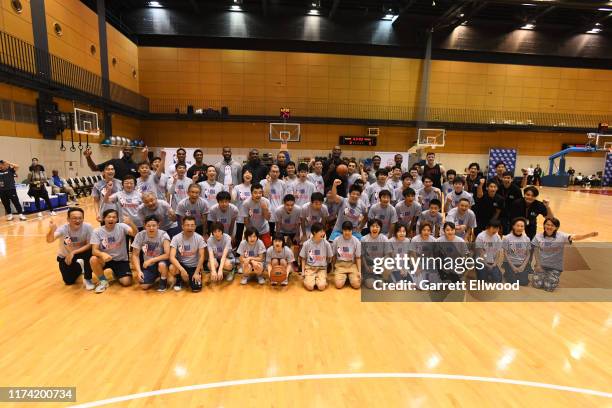 Both the Houston Rockets and Toronto Raptors take a group photo during the NBA Cares Special Olympics Unified Clinic part of the 2019 NBA Japan Games...