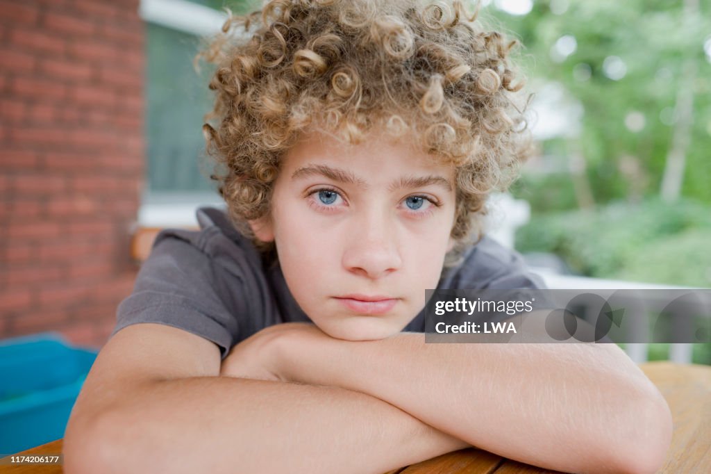 Portrait of curly haired boy