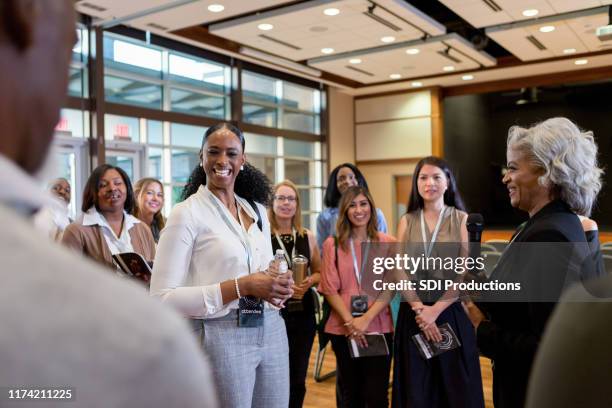 business conference meet and greet - diverse town hall meeting stock pictures, royalty-free photos & images