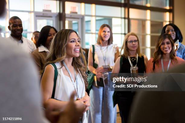 cheerful business people attend conference - exhibition stock pictures, royalty-free photos & images