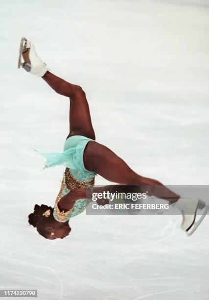 Surya Bonaly of France performs a backflip in her free skate routine in the women's Olympic figure skating in Nagano 20 February. The flip is not...