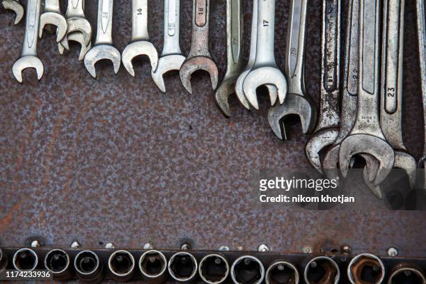 set of wrenches of hexagons of different sizes with a set of various screwdrivers.some wrenchs and tools on the tool shelf - open end spanner stock pictures, royalty-free photos & images