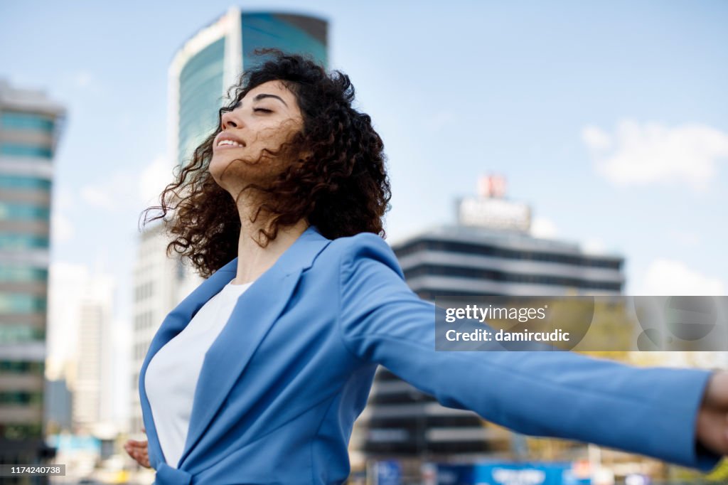 Happy young businesswoman