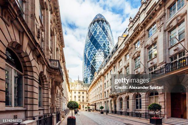 street in london with old historic houses and 'gherkin' skyscraper, england, uk - london landmark ストックフォトと画像